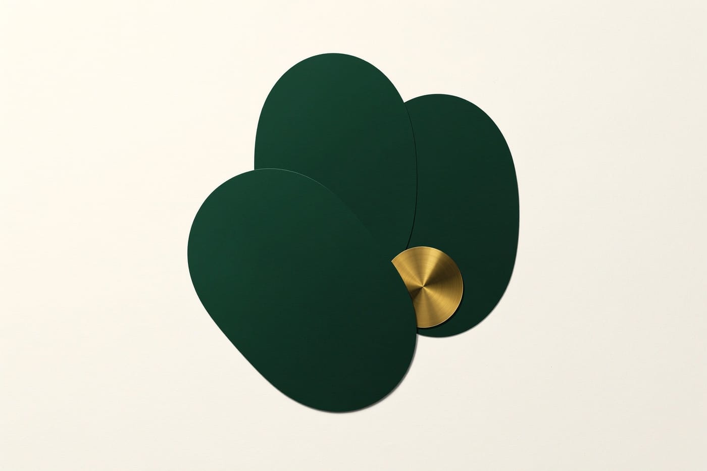 Three green discs fanned like cards with one gold disc among them
