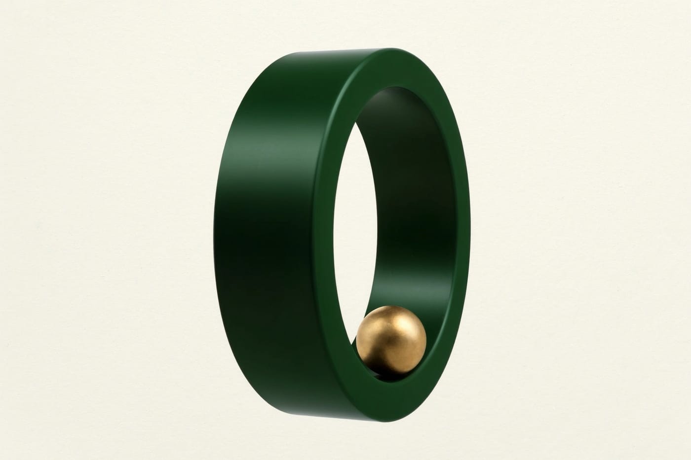 A green ring standing on edge with a gold sphere inside it