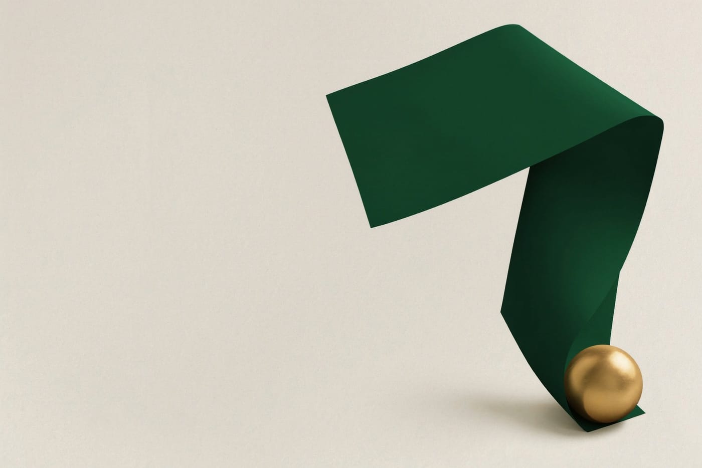 A green ribbon folded into a loop with a gold sphere at its tail