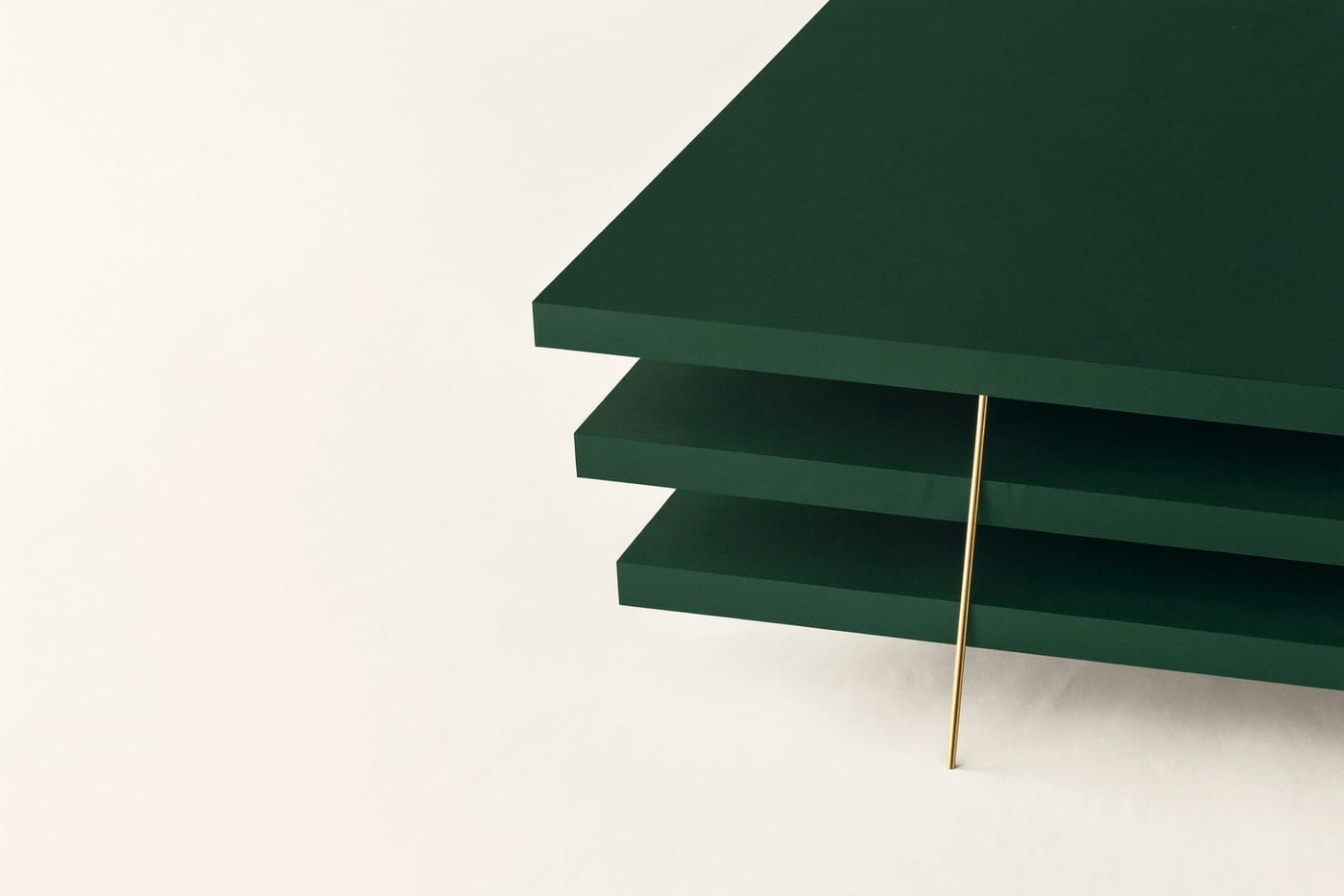 Stacked green slabs with a gold rod leaning against them